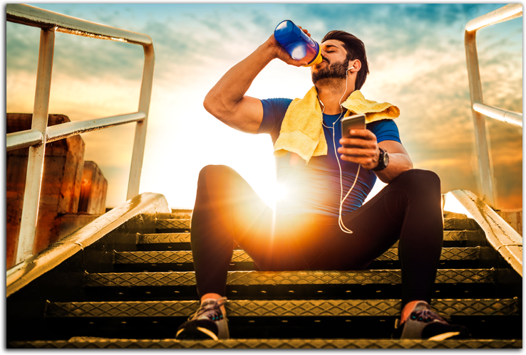 Man sitting on steps drinking water